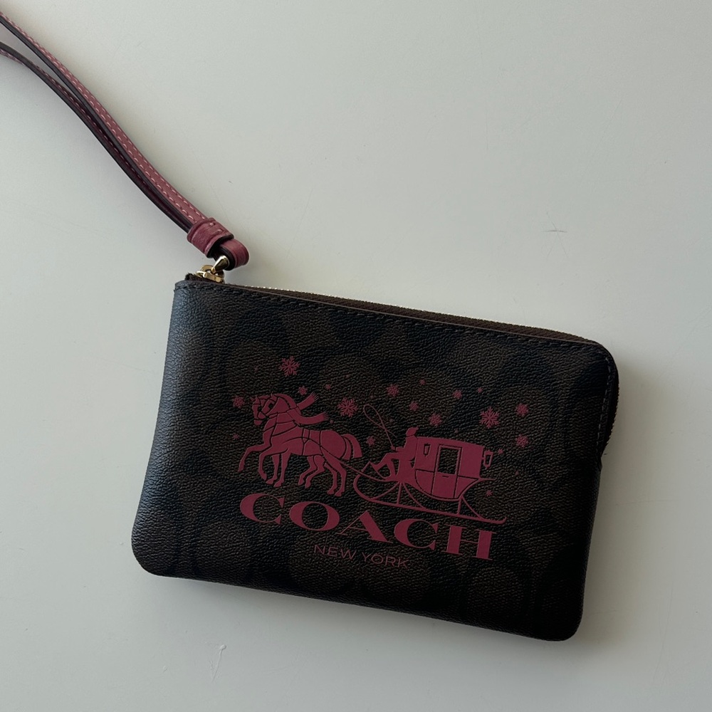 Coach Dark Brown Wristlet with Pink Font